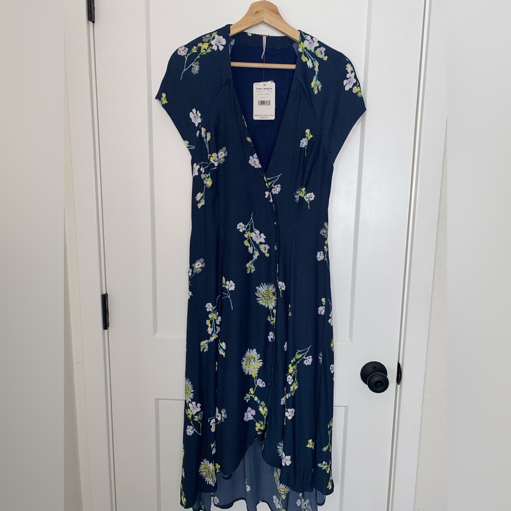 Navy blue dress with a floral design, V neck and button down in the the front
